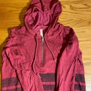 Hooded pullover with 3/4 zipper.
